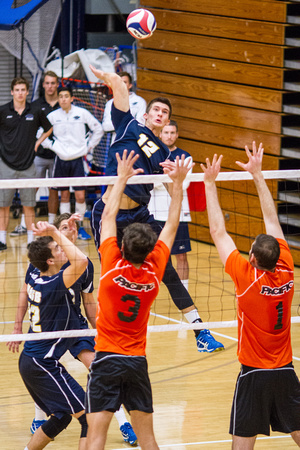 Jake Staahl (UC Santa Barbara) spikes over Peter Edwards and Marty Ross (Pacific)